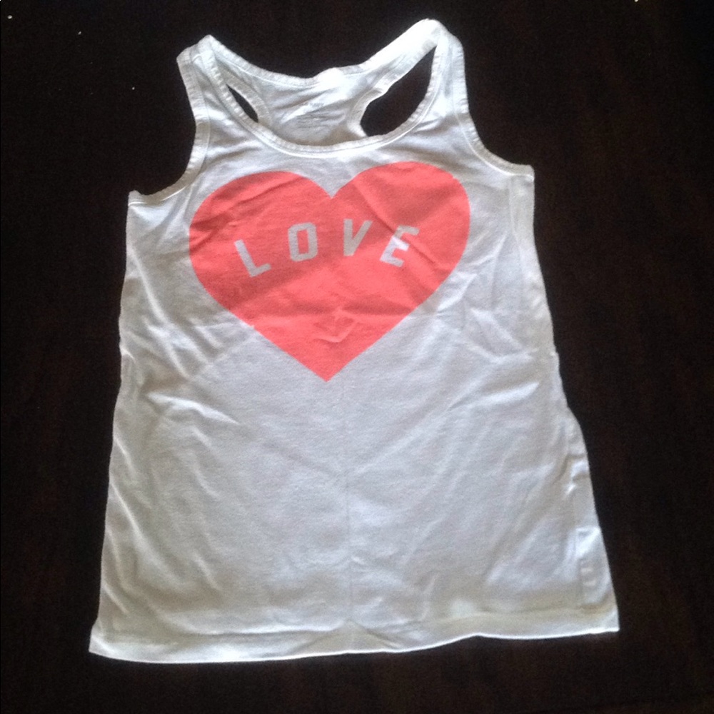 White tank top that says love on it and is size 8.